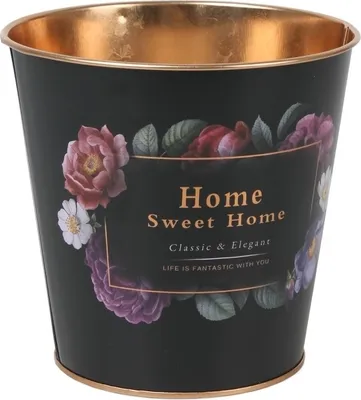A black metal planter with a floral design and gold trim.