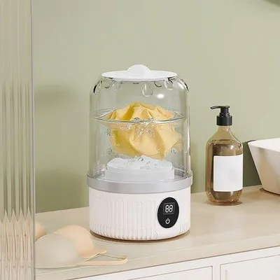 Productafbeelding van Mini-elektrische wasmachine van 1 liter, een klein, draagbaar was- en wolwasapparaat voor thuisgebruik.
