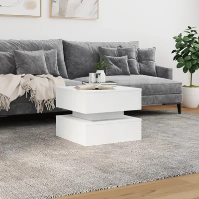 A modern living room scene with a gray sofa and a white coffee table.