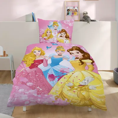 A Disney Princess themed duvet cover and pillowcase set laid out on a bed in a child's room.