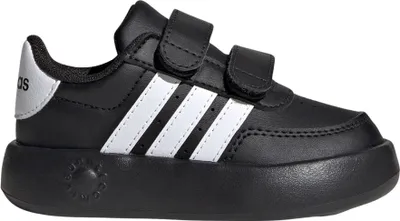 A studio shot of a single black Adidas sneaker with white stripes and a silver heel accent.