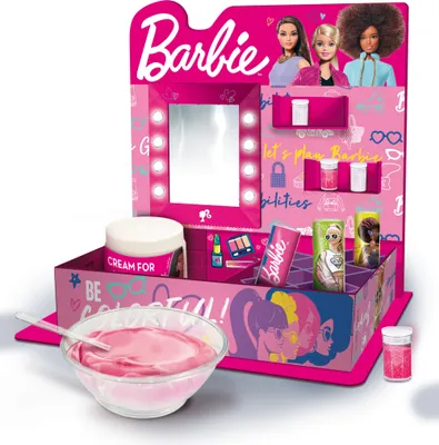 A Barbie-themed cosmetic play set with a mirror, lipstick-like containers, and a bowl of pink cream.