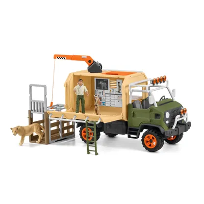 A toy veterinary rescue truck with figures and a lion.