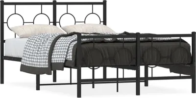 A black metal bed frame with a headboard and footboard, shown with bedding.