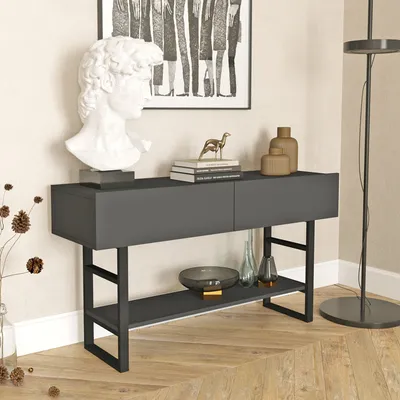 A console table with decorative items in a room setting.