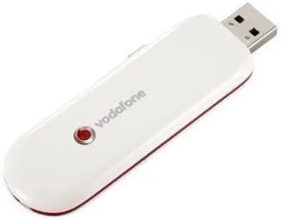 A white Vodafone USB modem is shown on a white background.