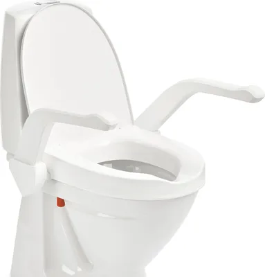 A white toilet seat riser with armrests, shown from a slightly angled front view against a white background.