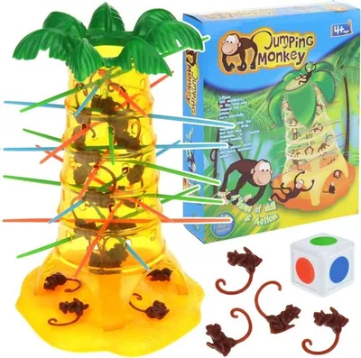 A product shot of the 'Jumping Monkey' arcade game, including the game tower, dice, and monkey figures, along with its packaging.