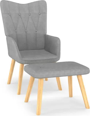 A gray fabric armchair and footrest with wooden legs are shown against a white background.