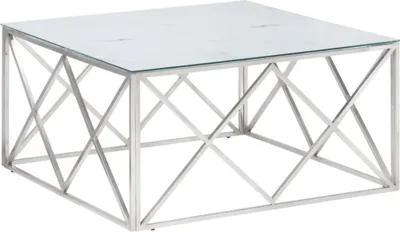 A square coffee table with a glass top and a silver metal frame with a geometric design.