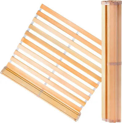 A wooden bed slatted base, partially unrolled and partially rolled up.