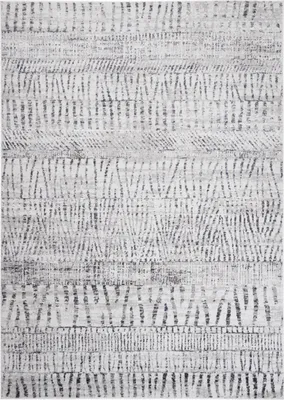 A close-up view of a rug with a geometric pattern.