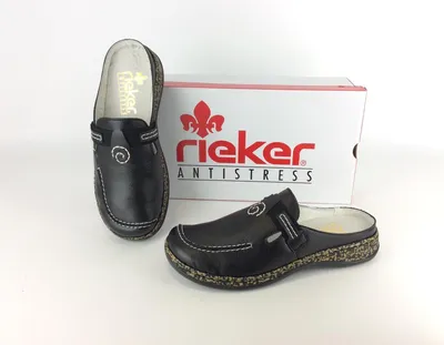 A pair of black Rieker clogs and their original packaging are displayed on a white background.