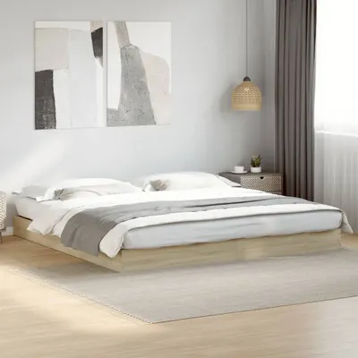 A bedroom scene with a bed frame and bedding.