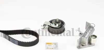 A set of car engine timing belt components is laid out on a white background.
