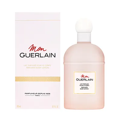 A product shot of a Guerlain Mon Guerlain Perfumed Body Lotion bottle and its packaging, presented on a white background.