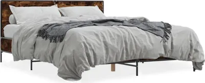 A bed with a wooden headboard and a gray blanket.
