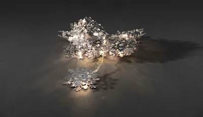 Produktbild von Konstsmide - LED Dekolichterkette, silberfarbene Metallschneeflocken, 10 warm weiße Dioden, batteriebetrieben, Innen, transparentes Kabel; 3146-303