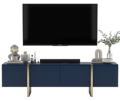 A navy blue TV cabinet with a television and decorative items on top.
