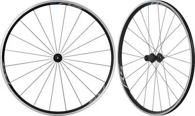 Produktbild von Shimano WHRS100 C24 10/11-K. 29/28" (622 mm) Felgenbremse 9x100-9x130 Shimano HG Paar Räder