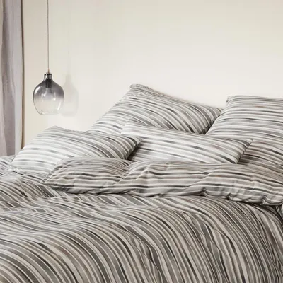 Produktbild von elegante Interlock Jersey Bettwäsche Desire natur grau 135x200 cm + 80x80 cm