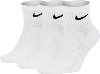 Three white Nike ankle socks are arranged in a slight diagonal formation against a white background.