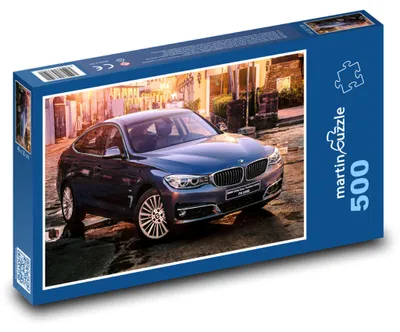 Zdjęcie produktu dla Puzzle 500 Niebieski samochód sportowy w mieście - martinpuzzle