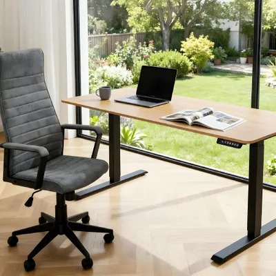 A modern office setup with a height-adjustable desk and ergonomic chair, overlooking a lush garden.