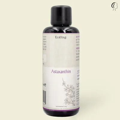 A bottle of Astaxanthin supplement against a plain background.
