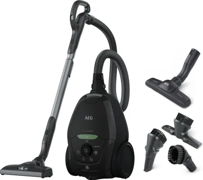 A black canister vacuum cleaner with its accessories displayed on a white background.