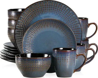 A set of blue and brown ceramic dishes and mugs arranged on a white background.