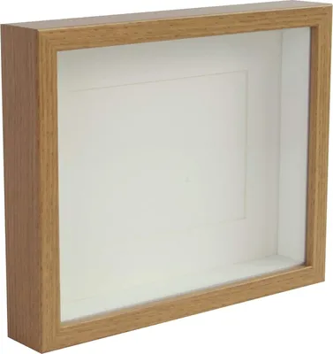 A shadow box frame with a wooden border and a white matting.