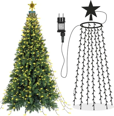 A Christmas tree decorated with lights and a star on top, next to a separate string of lights with a plug.