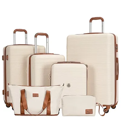 A collection of luggage pieces arranged on a white background.