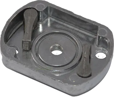 A close-up, angled view of a metal starter plate for a motor-powered tool.