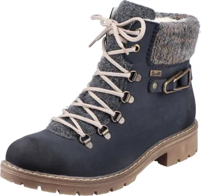 A single blue boot with tan laces and a gray knitted cuff.