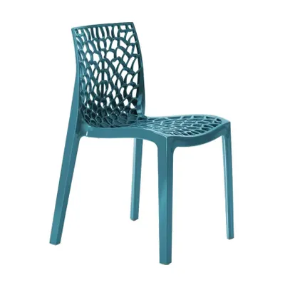 A single turquoise chair with a patterned back and seat is shown against a white background.