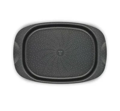 A top-down view of a black rectangular baking dish with handles on a white background.