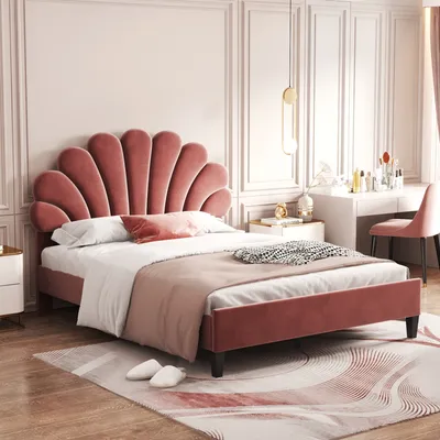 A bedroom scene featuring a pink velvet bed with a shell-shaped headboard.