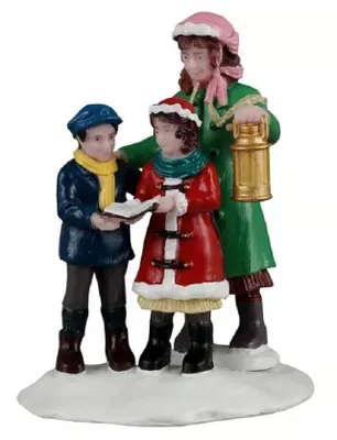 Diese Figur zeigt drei Personen. Figur erinnert an traditionelles Weihnachtslieder singen.