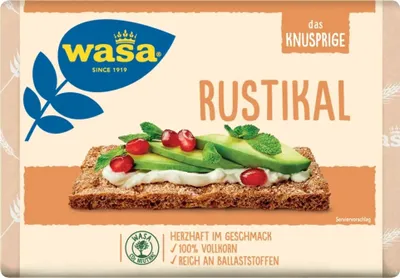 A package of Wasa Rustikal knäckebrot with a topping of cream cheese, avocado, and berries.