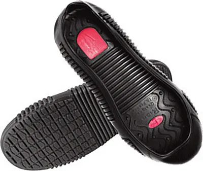 The underside of two black shoe covers with red inserts.