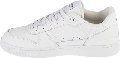 A side view of a white Lacoste sneaker.