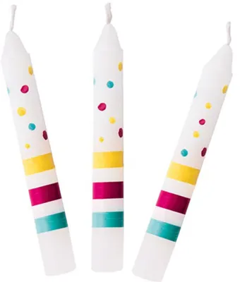 Three birthday candles with colorful polka dots and stripes.