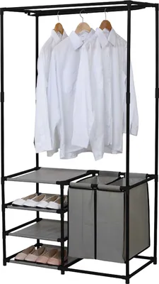 A black metal garment rack with shelves and a laundry hamper, holding white shirts and shoes.