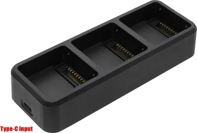 A black multi-battery charger with three slots and a USB-C input port.