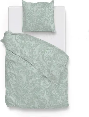 A top-down view of a duvet cover and pillow on a white bed.