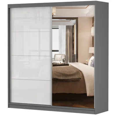 A sliding door wardrobe with a mirrored section reflecting a bedroom.