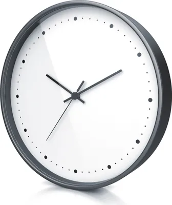A close-up, angled view of a round wall clock with a black frame and a white face.