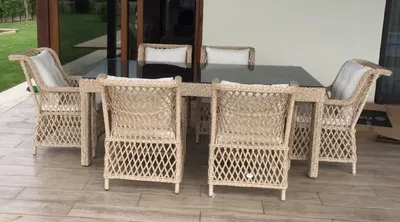 Produktbild von Casa Padrino Luxus Rattan Gartenmöbel Set Naturfarben - 1 Rattan Garten Esstisch mit Glasplatte & 6 Rattan Gartenstühle mit Armlehnen - Moderne Luxus Rattan Garten & Terrassen Möbel